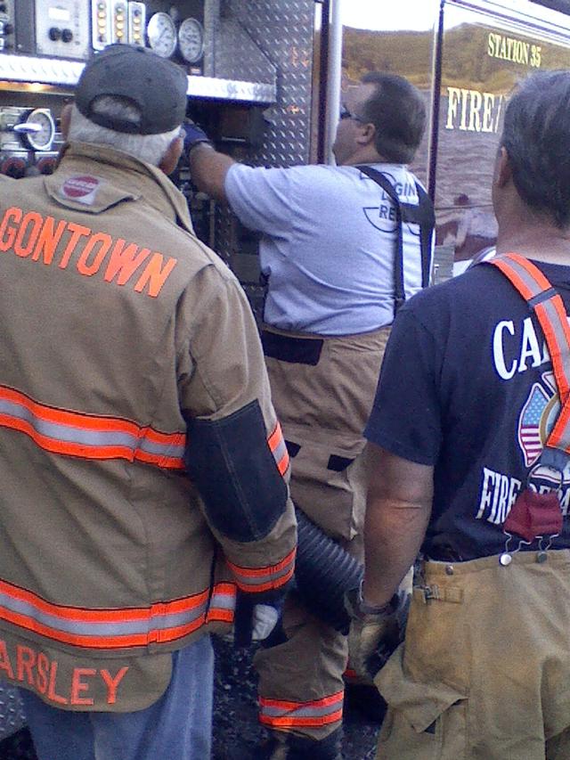 Assistant Chief Yearsley with Engineer McCoy watching over the Captain on E-35